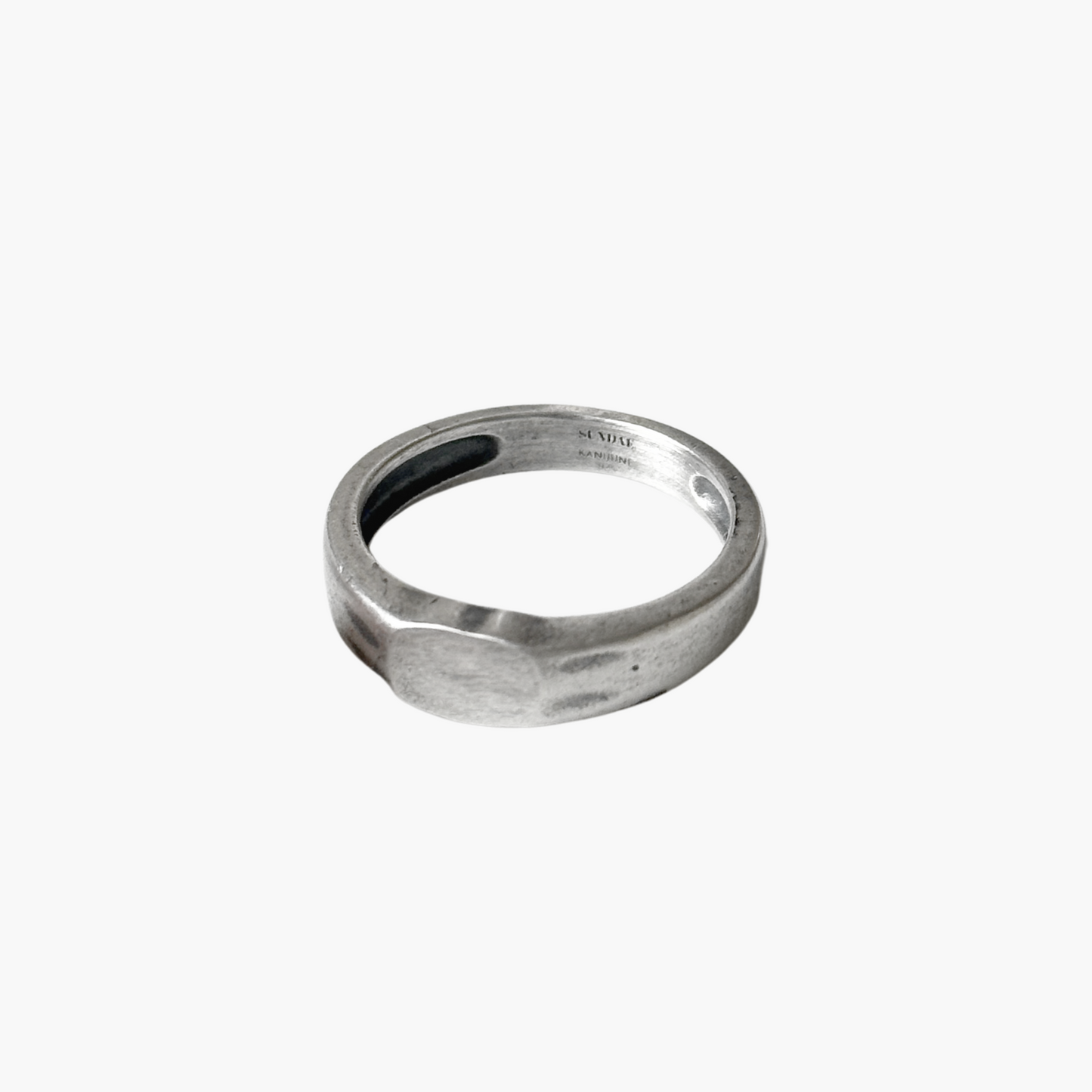 silver signet ring product picture in front of white background