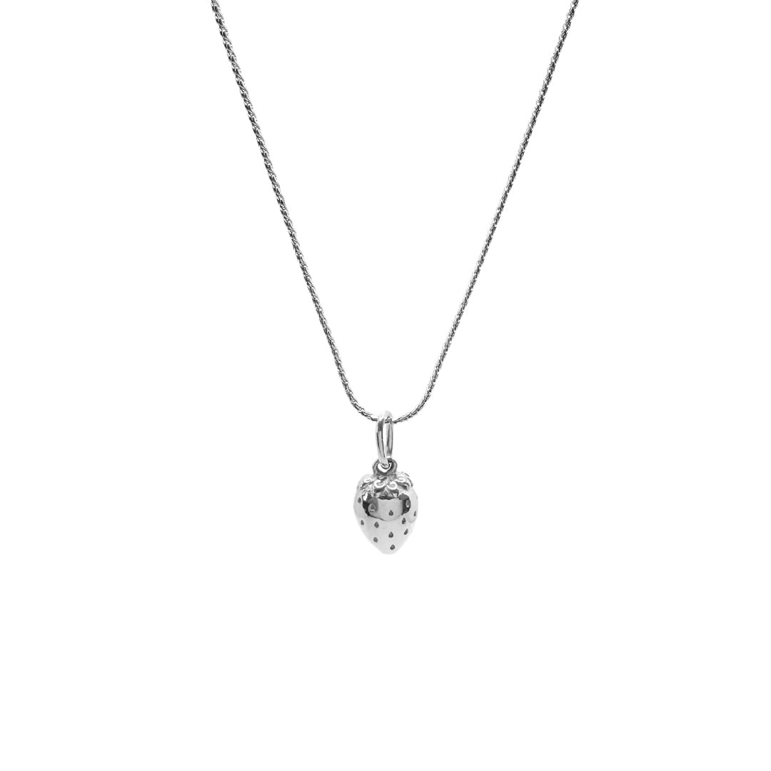 silver strawberry necklace on white background
