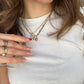 necklaces worn on white tee 