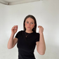 woman wearing teddy necklace with bald t-shirt in studio photobox